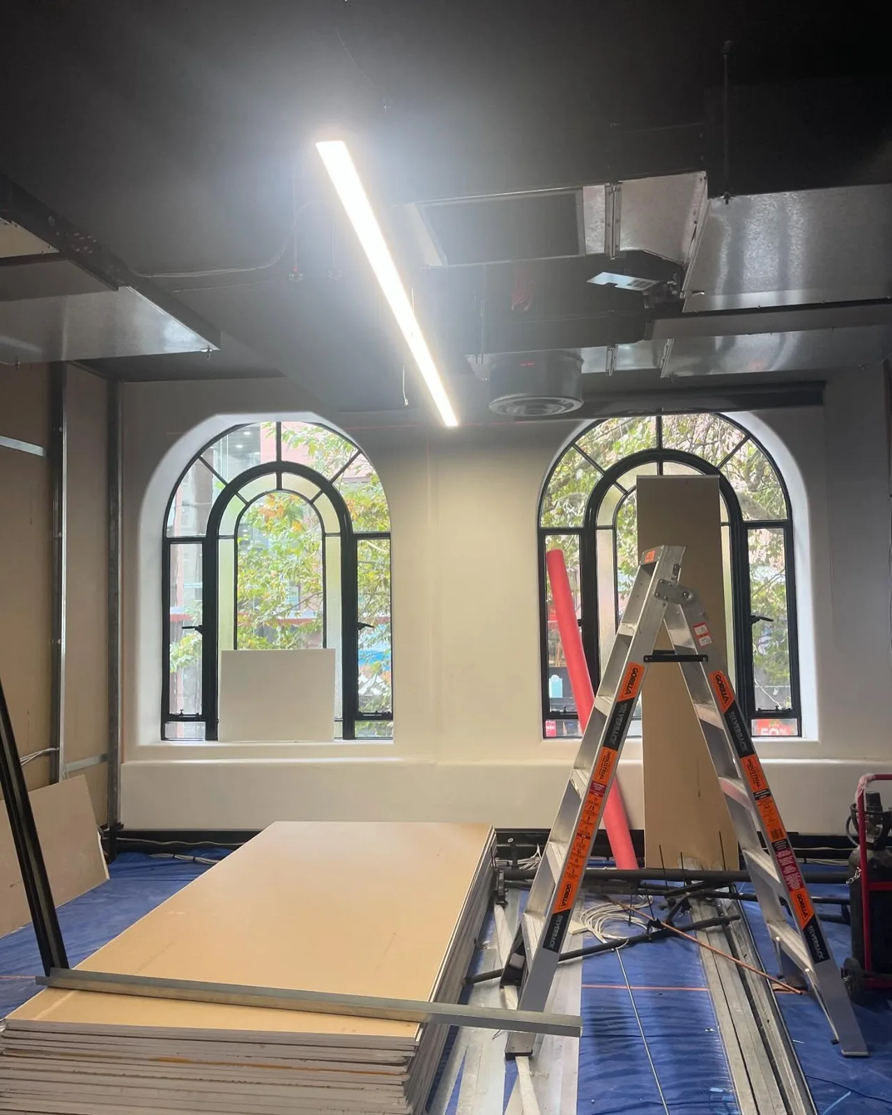 Interior painting work with access equipment in place