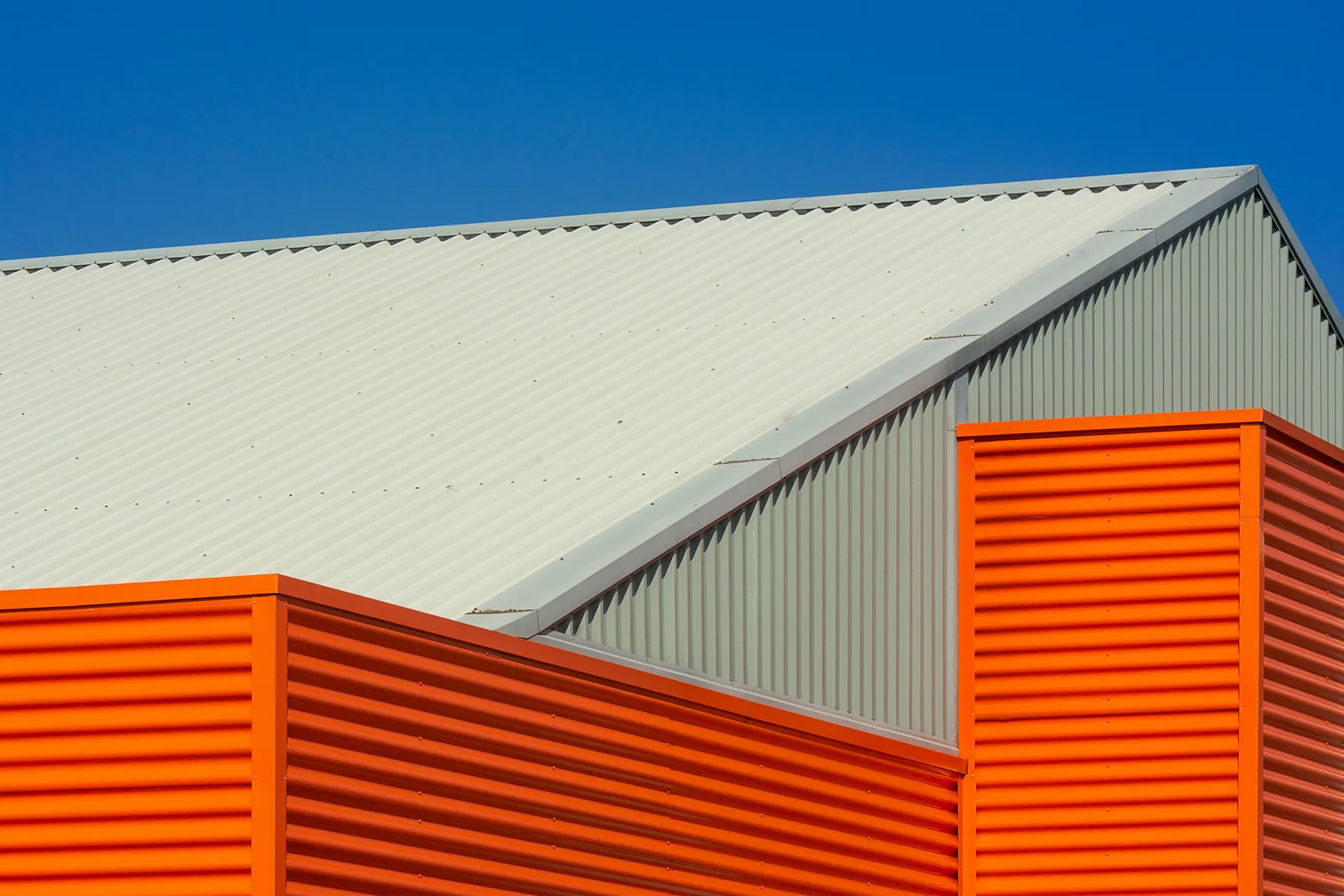 Metal roof and upper cladding on a commercial building